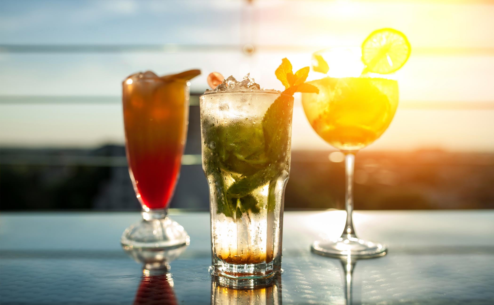 Refreshing cocktails on a sunlit deck with ocean views | MSC Cruises