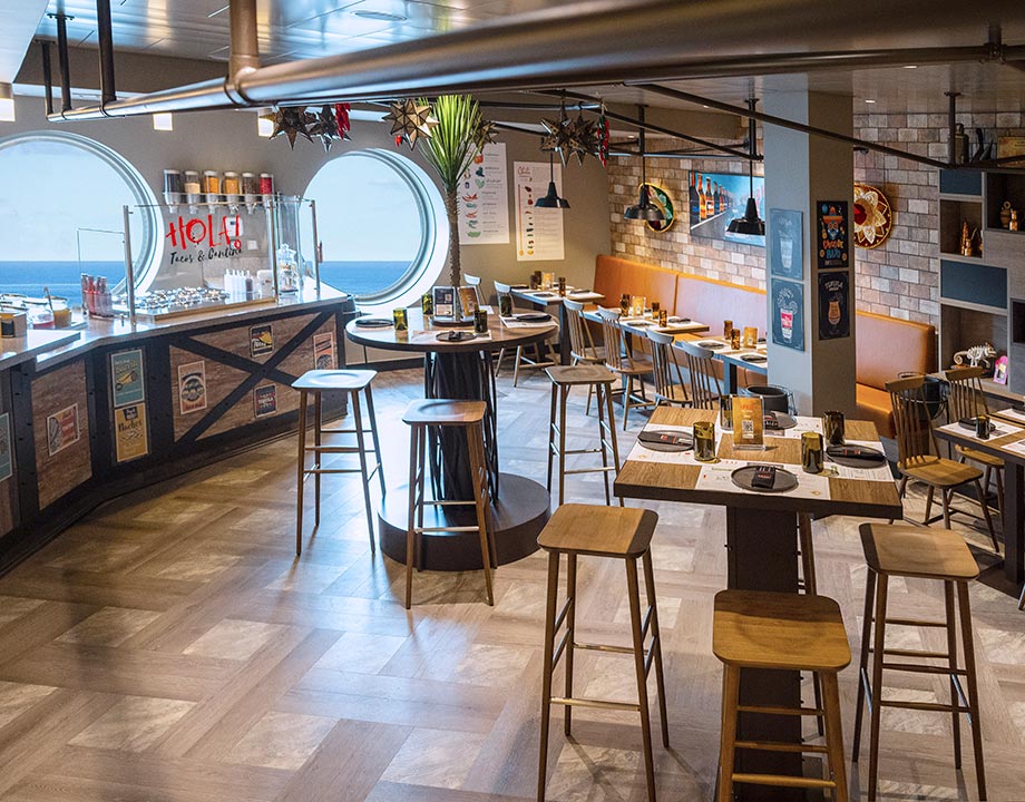 A vibrant onboard Mexican restaurant with ocean views and festive decor | MSC Cruises